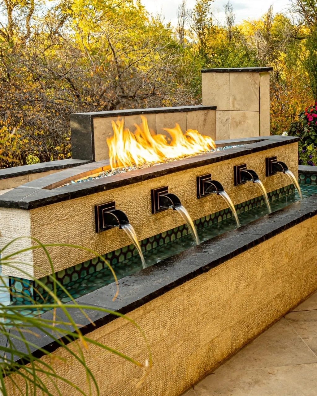 Custom fire and water feature, outdoor living fabrication Denver